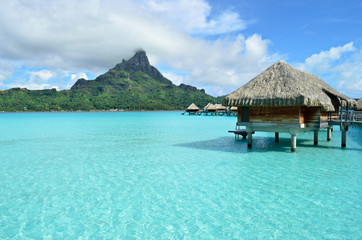 Luxury overwater vacation resort on Bora Bora - obrazy, fototapety, plakaty