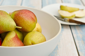 blush pears in a bowl