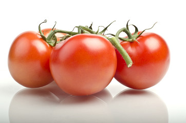 Fresh ripe red tomatoes with reflection