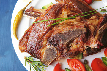 beef meat fillet on white plate with tomatoes