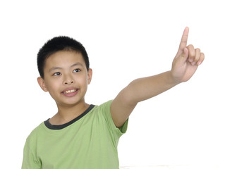 a cute little boy pointing upward