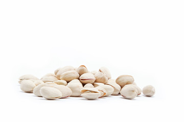 pistachios heap against white background