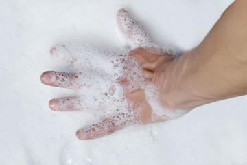 Hand in foam.