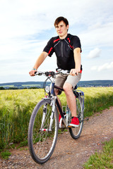 Young man riding a bicycle