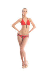 A young Caucasian woman posing in a red swimsuit