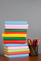 Pencils on the stack of books
