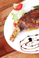 over wood: grlled shoulder on plate