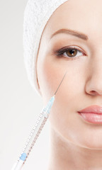 Portrait of a young woman on a botox injection procedure