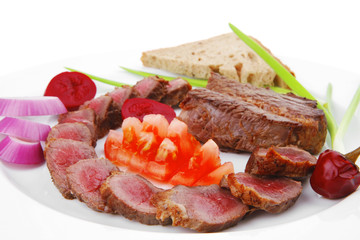 meat food : roast red meat slices served on white plate
