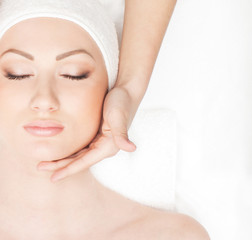 Portrait of a young woman laying on a spa procedure