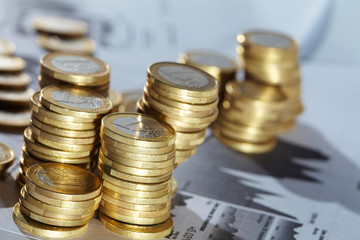 Business diagram on financial report with coins