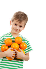 Boy holding oranges