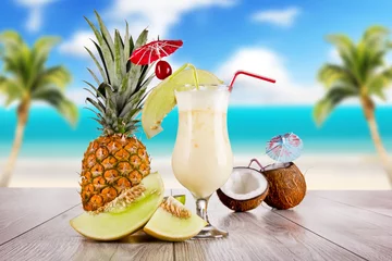 Foto op Canvas Summer drink with blur beach on background © Jag_cz