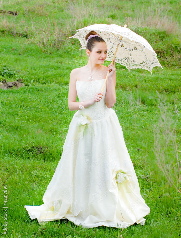 Wall mural happy beautiful bride on wedding day outdoors