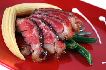 roast meat served with corns