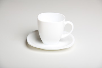 white cup with white saucer