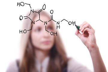 woman chemist shows a molecular structure