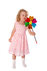 Little girl blowing on the windmill