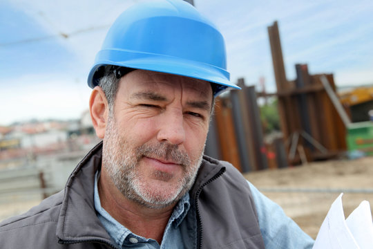 Portrait of entrepreneur on building site