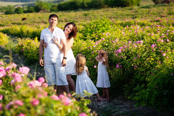 Family in rose flowers