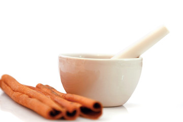 Coffee cup and cinnamon sticks