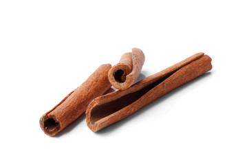 Cinnamon sticks lying isolated on white background