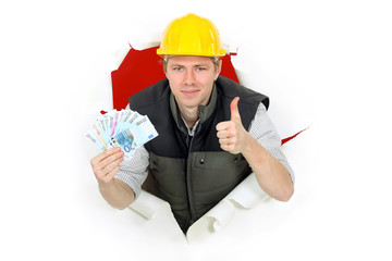 Thumbs up from a builder holding cash