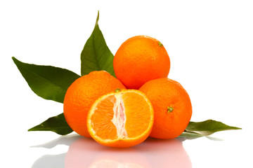 Ripe tasty tangerines with leaves and segments isolated on