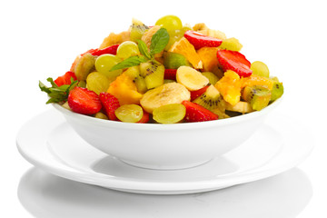 bowl with fresh fruits salad  isolated on white