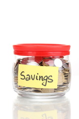 Glass bank for tips with money isolated on white