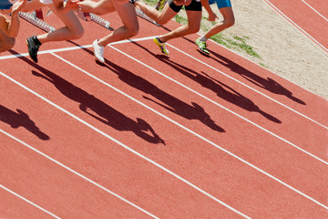 the shadow of the runners at the starting line