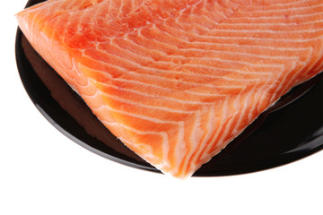 fresh uncooked red fish fillet on black