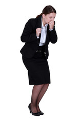 Businesswoman sneezing