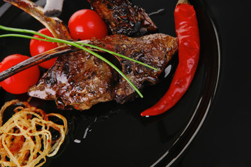 grilled ribs on black