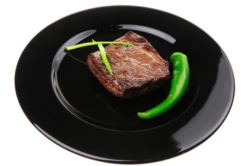 meat food : roasted fillet mignon on black plate with chives