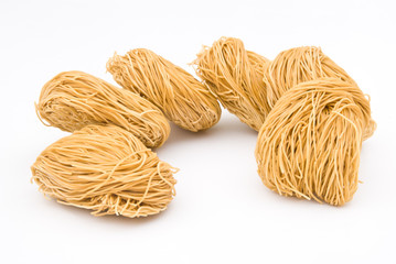 raw noodles on white background