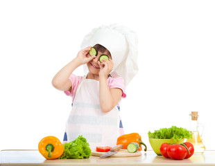 Funny chef girl preparing healthy food over white background