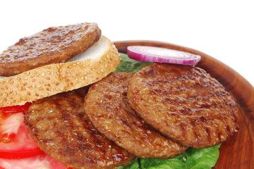 large roast hamburger with loaf on wood