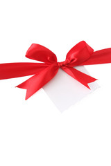 a red ribbon with a bow on white