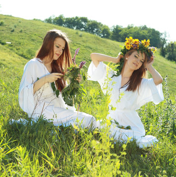 women garlanding flowers