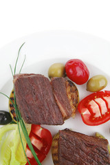 steak garnished with baked apples