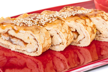 Omelet Maki Sushi - Roll made of Smoked Eel inside. Topped with