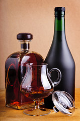 glass and bottles of brandy