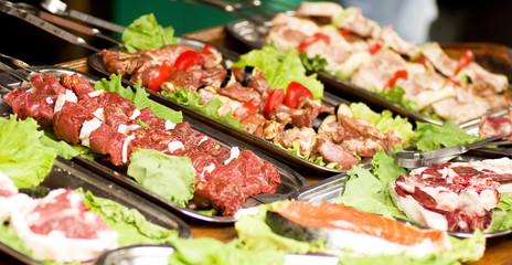 Appetizing weal kebab on skewers with tomatoes, pepper