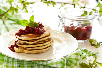 Stack pancakes with cherry sauce