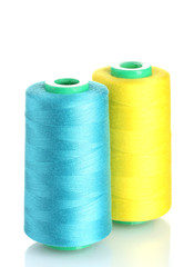 Bobbins of thread isolated on white