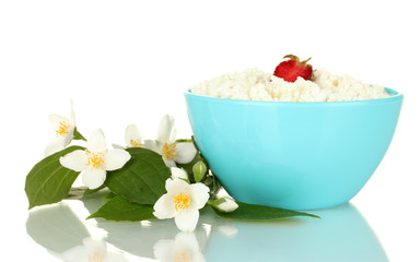 cottage cheese with strawberry in blue bowl and flowers