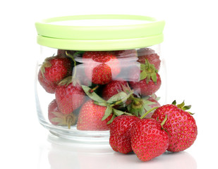 Sweet ripe strawberries in jar isolated on white