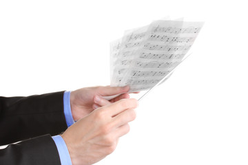 Fototapeta premium Music conductor hands with baton and notes isolated on white
