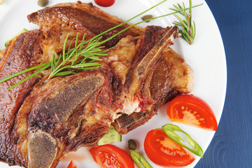 beef meat bone steak and tomatoes